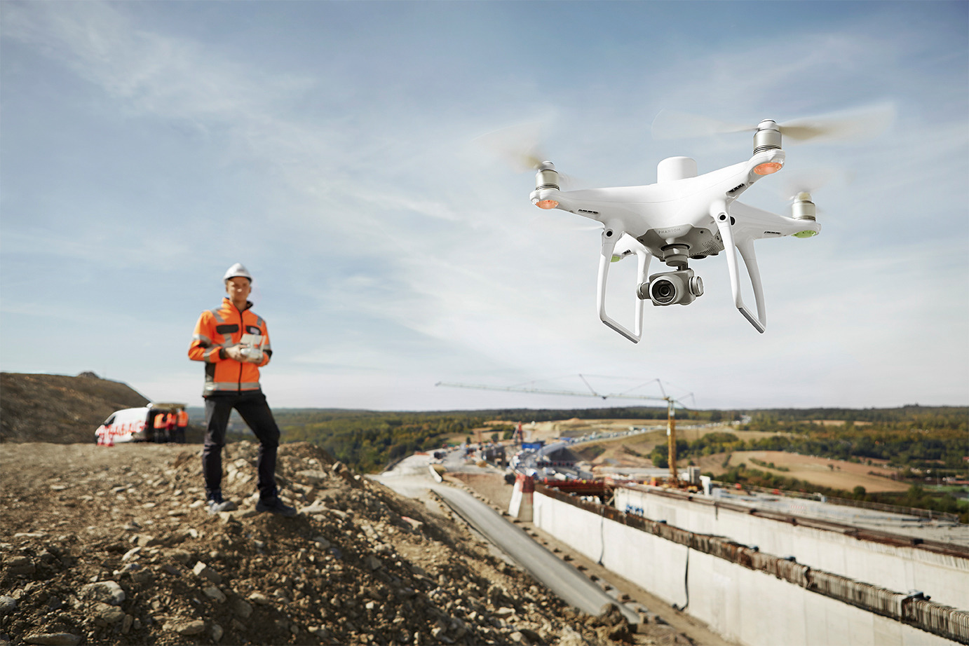 Pilot using the P4 RTK drone to survey a landscape
